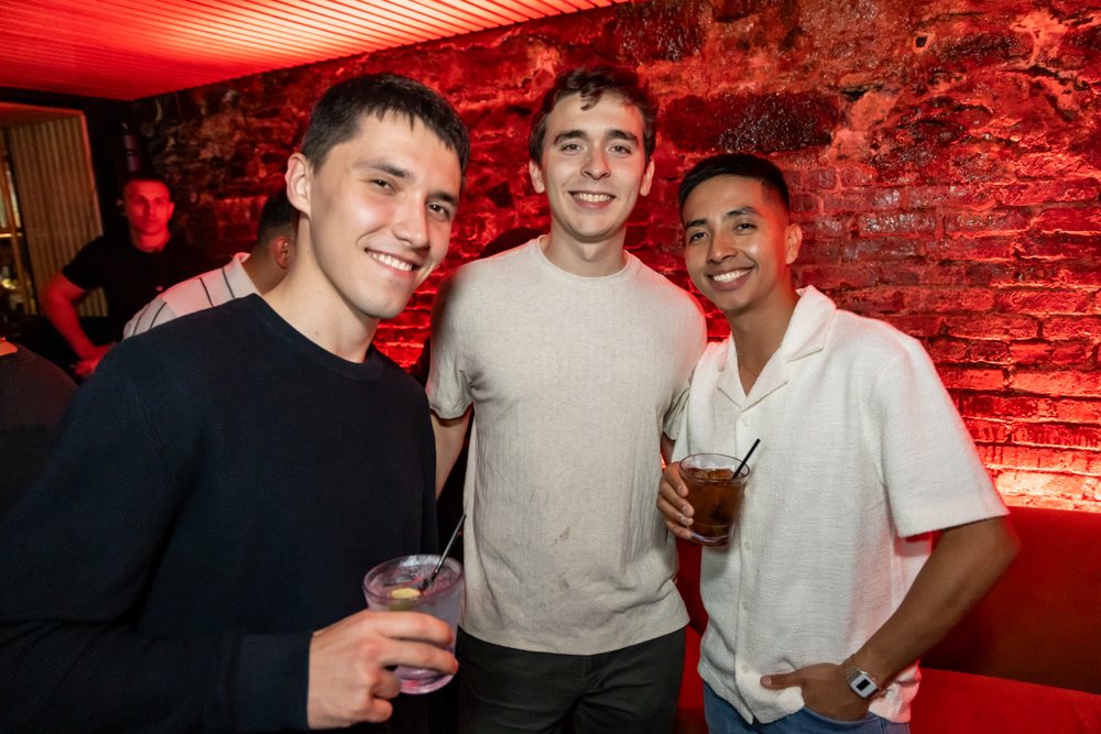 Three friends with cocktails
